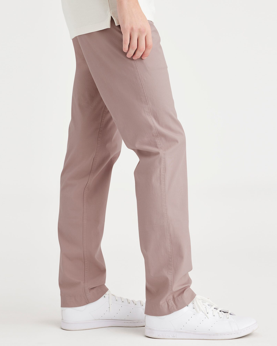 Side view of model wearing Fawn Men's Slim Fit Smart 360 Flex California Chino Pants.