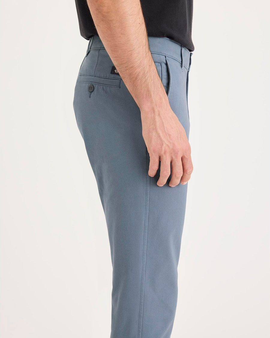 Side view of model wearing Folkstone Gray Ultimate Chino Pants with Smart 360 Flex™, Skinny Fit.