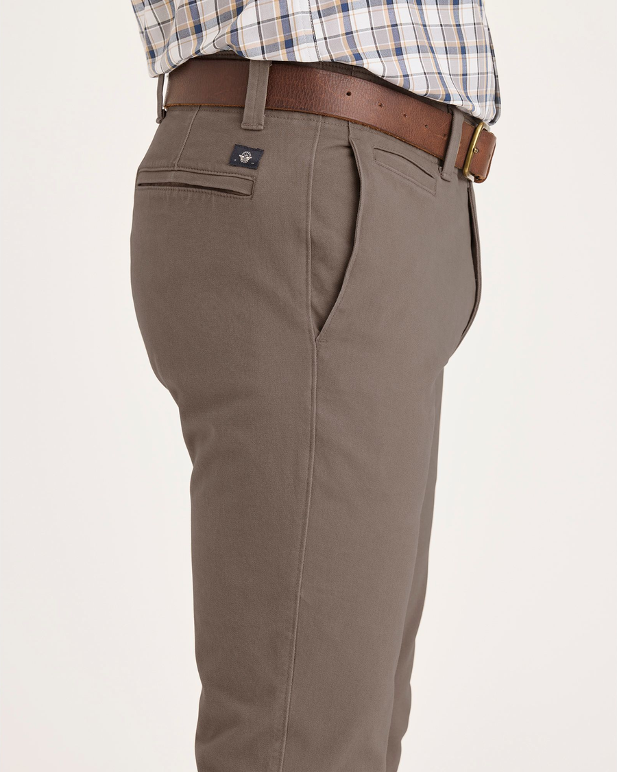 Side view of model wearing Fossil Alpha Chino Pants, Skinny Fit.