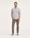 Front view of model wearing Fossil Men's Skinny Fit Smart 360 Flex California Chino Pants.