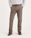 Front view of model wearing Fossil Men's Slim Fit Smart 360 Flex Alpha Chino Pants.