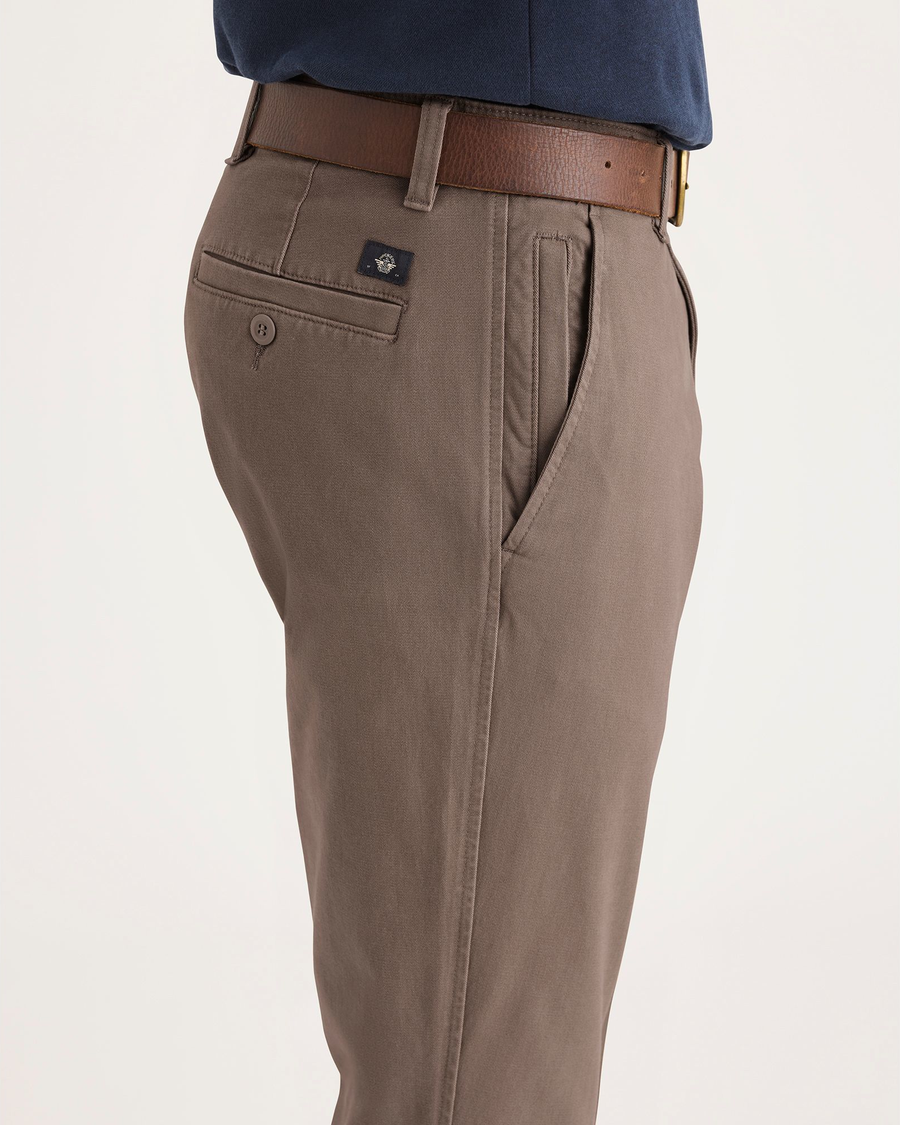 Side view of model wearing Fossil Men's Smart 360 Flex Ultimate Chino.