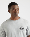 View of model wearing Gray Heather Men's Slim Fit Logo Tee.