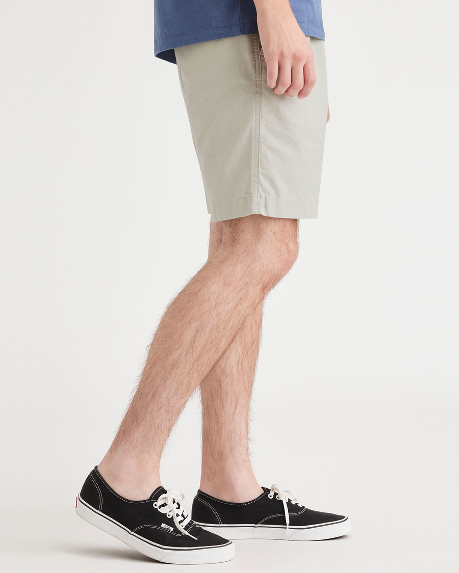 Side view of model wearing Grit Men's Pull-On Playa Short.