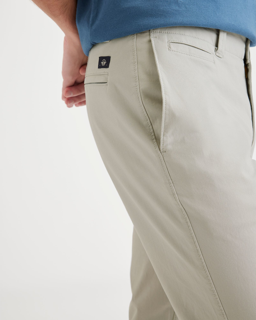 View of model wearing Grit Men's Skinny Fit Smart 360 Flex California Chino Pants.