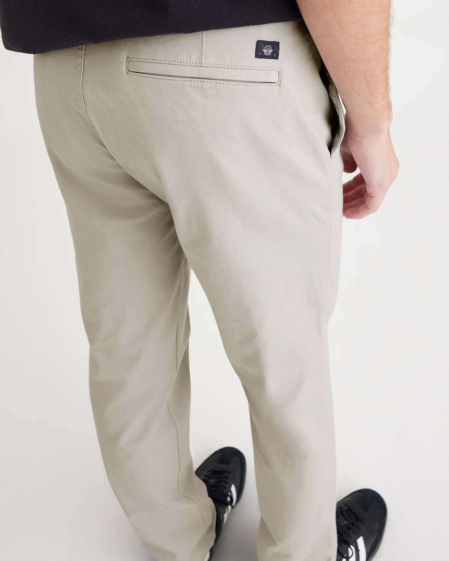 View of model wearing Grit Men's Slim Fit Smart 360 Flex California Chino Pants.
