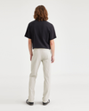 Back view of model wearing Grit Men's Slim Fit Smart 360 Flex California Chino Pants.