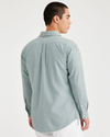 Back view of model wearing Harbor Gray Men's Slim Fit Icon Button Up Shirt.