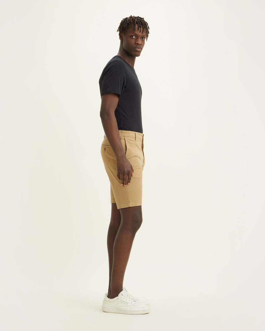 Side view of model wearing Harvest Gold Big and Tall Supreme Flex Modern Chino Shorts.