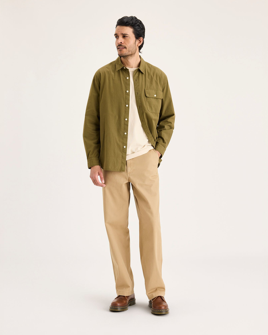 View of model wearing Harvest Gold Eighty-Six Alpha Chino Pants, Loose Fit.