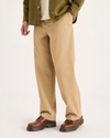 View of model wearing Harvest Gold Eighty-Six Alpha Chino Pants, Loose Fit.