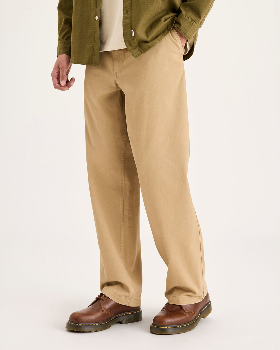 View of model wearing Harvest Gold Eighty-Six Alpha Chino Pants, Loose Fit.