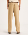 Back view of model wearing Harvest Gold Eighty-Six Alpha Chino Pants, Loose Fit.