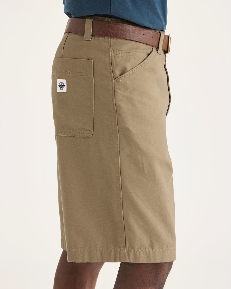 Side view of model wearing Harvest Gold Men's Loose Fit Eighty-Six Dock 10" Shorts.