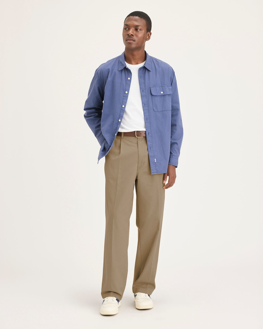 Front view of model wearing Harvest Gold Men's Loose Fit Eighty-Six Original Pleated Chino Pants.