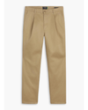 Front view of model wearing Harvest Gold Men's Relaxed Tapered Fit Original Chino Pants.