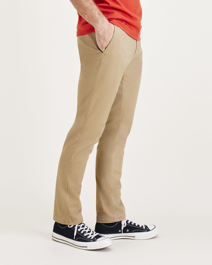 Side view of model wearing Harvest Gold Men's Skinny Fit Original Chino Pants.