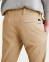 View of model wearing Harvest Gold Men's Skinny Fit Smart 360 Flex California Chino Pants.