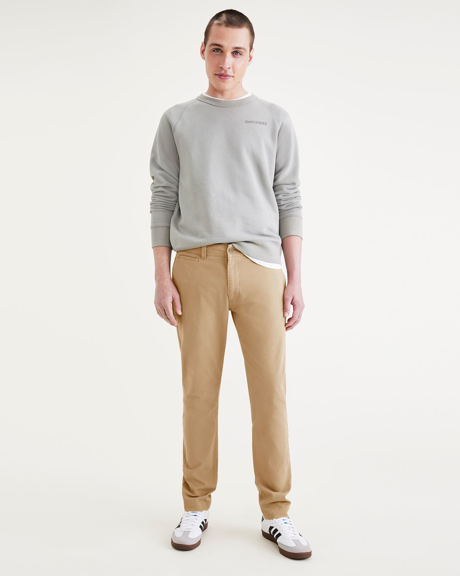 Front view of model wearing Harvest Gold Men's Skinny Fit Smart 360 Flex California Chino Pants.