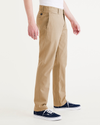Side view of model wearing Harvest Gold Men's Slim Fit Smart 360 Flex California Chino Pants.