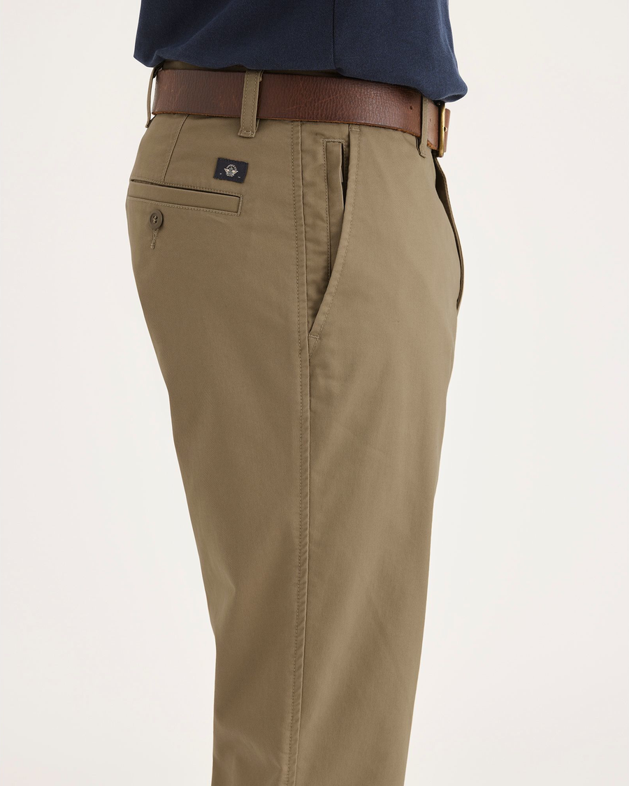 Side view of model wearing Harvest Gold Men's Slim Fit Smart 360 Flex Ultimate Chino Pants.