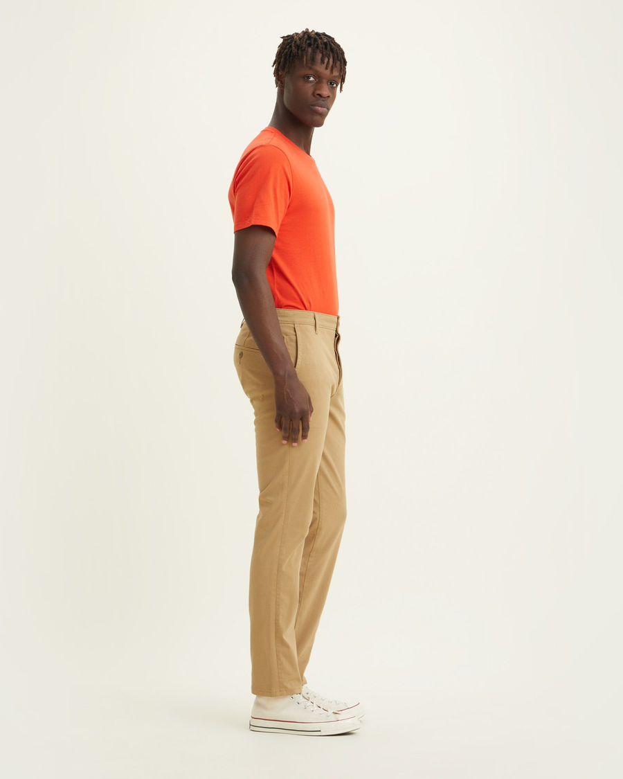 Side view of model wearing Harvest Gold Men's Slim Fit Supreme Flex Alpha Khaki Pants.