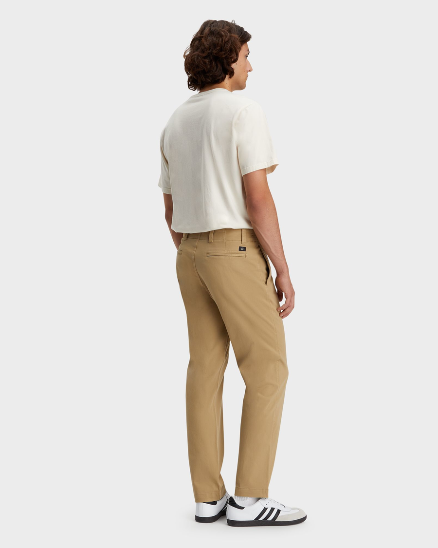 Back view of model wearing Harvest Gold Men's Straight Fit Smart 360 Flex California Chino Pants.