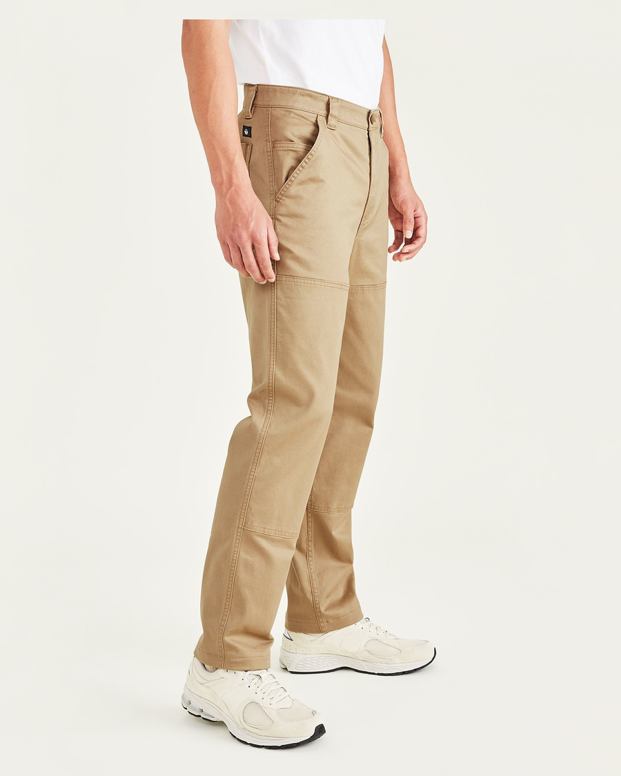Side view of model wearing Harvest Gold Men's Straight Fit Utility Pants.