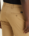 View of model wearing Harvest Gold Men's Supreme Flex Modern Chino Short.