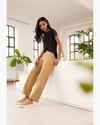 Front view of model wearing Harvest Gold Women's High Waisted Straight Fit Original Khaki Pants.