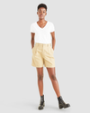 Front view of model wearing Harvest Gold Women's Pleated Original Shorts.