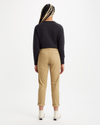 Back view of model wearing Harvest Gold Women's Slim Fit Weekend Chino Pants.