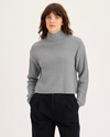 Front view of model wearing Heather Gray Mockneck Sweater, Relaxed Fit.