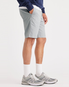 Side view of model wearing High-Rise Alpha Chino Shorts, Straight Fit.