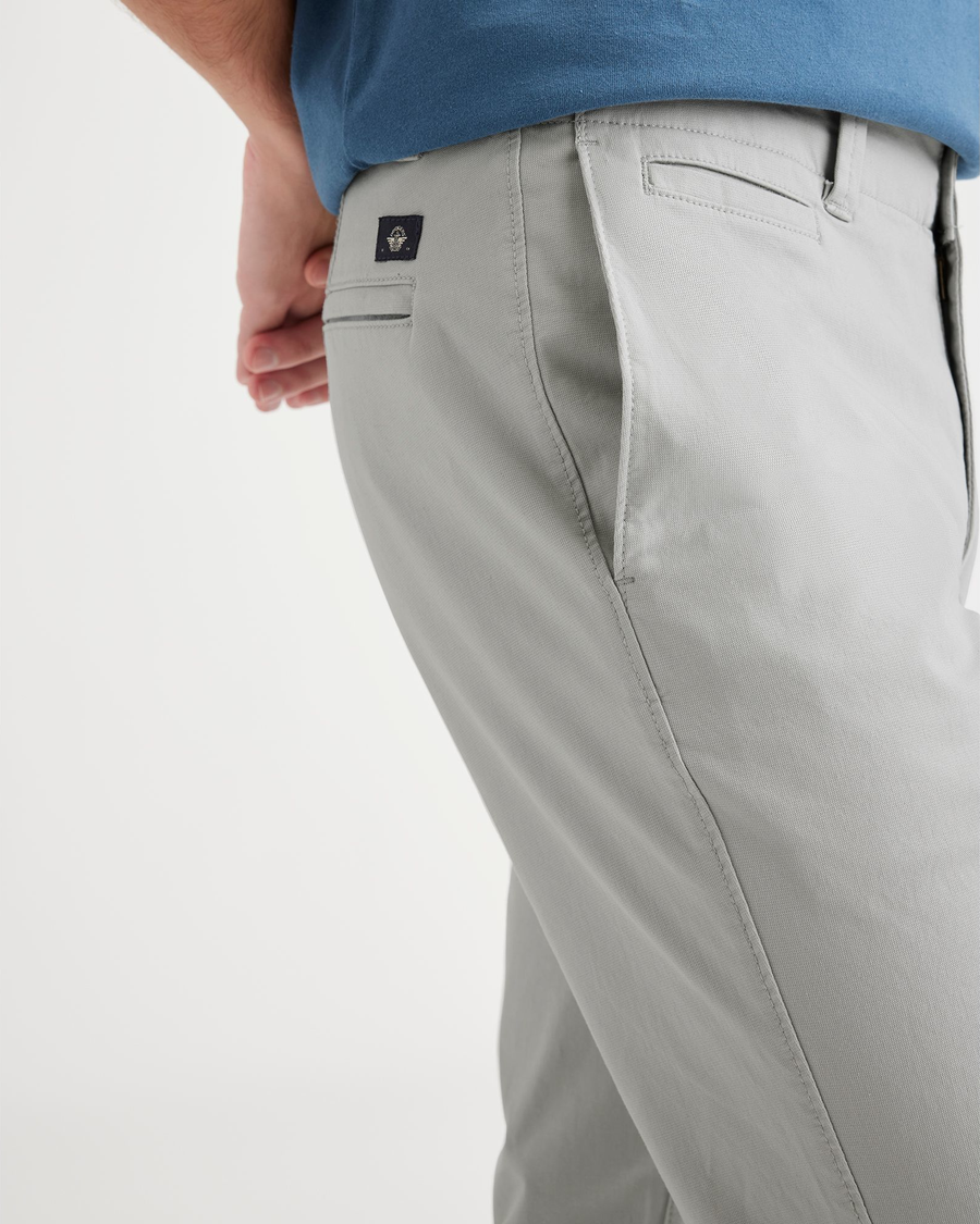 View of model wearing High-Rise Men's Skinny Fit Smart 360 Flex California Chino Pants.