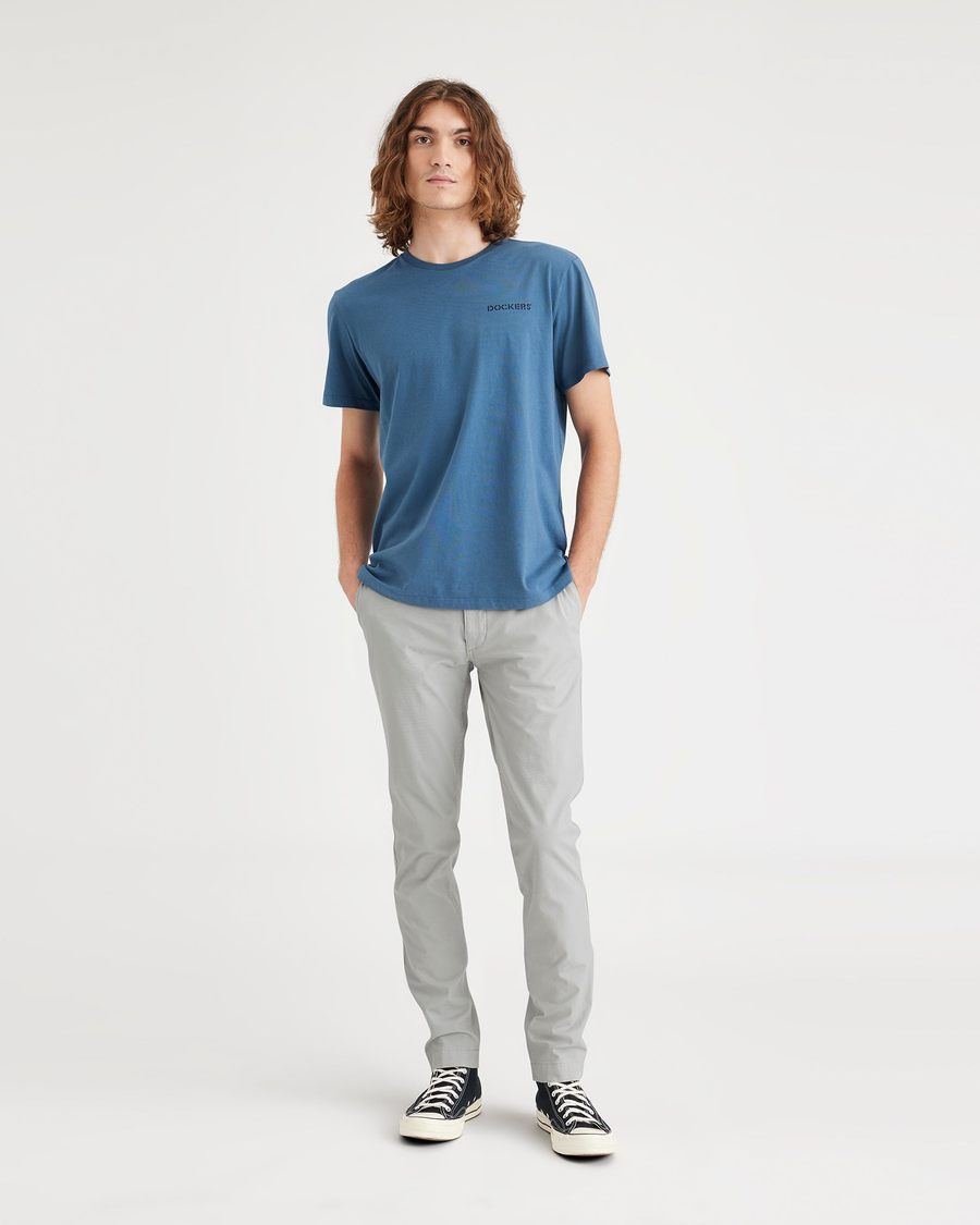 Front view of model wearing High-Rise Men's Skinny Fit Smart 360 Flex California Chino Pants.