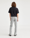 Back view of model wearing High-Rise Men's Slim Fit Smart 360 Flex California Chino Pants.