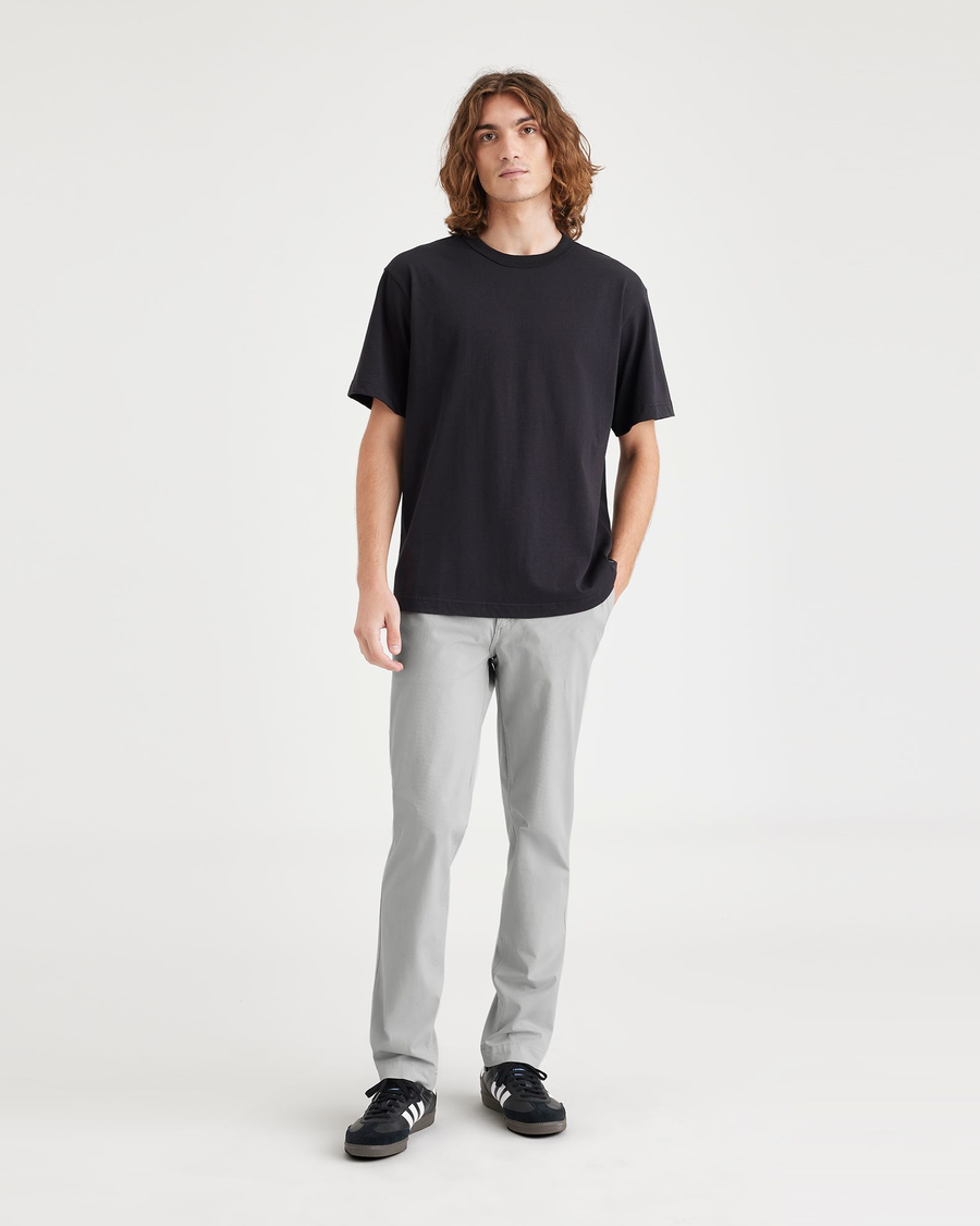Front view of model wearing High-Rise Men's Slim Fit Smart 360 Flex California Chino Pants.