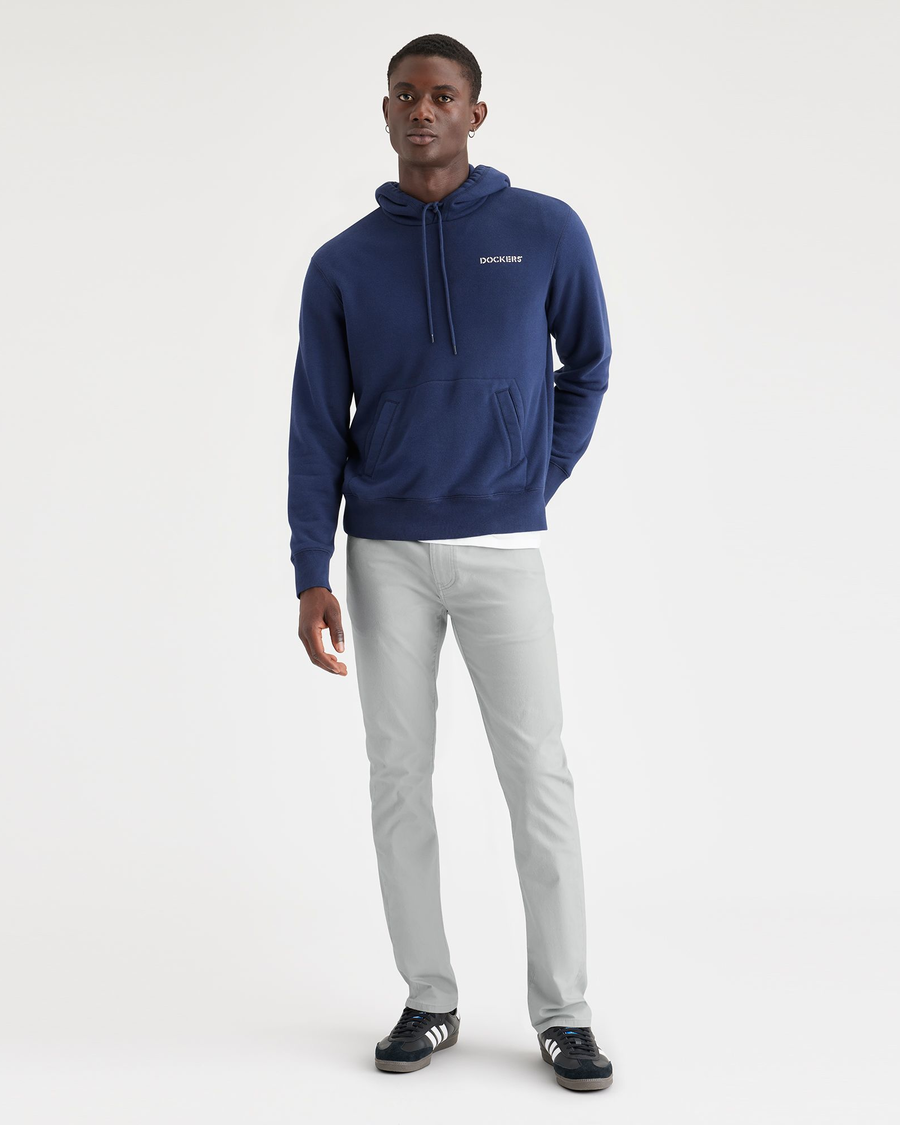 View of model wearing High-Rise Men's Slim Fit Smart 360 Flex Jean Cut Pants.
