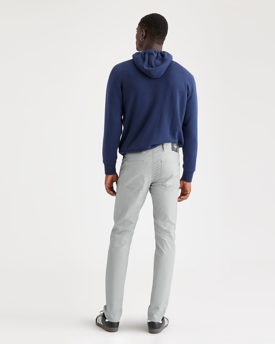 Back view of model wearing High-Rise Men's Slim Fit Smart 360 Flex Jean Cut Pants.