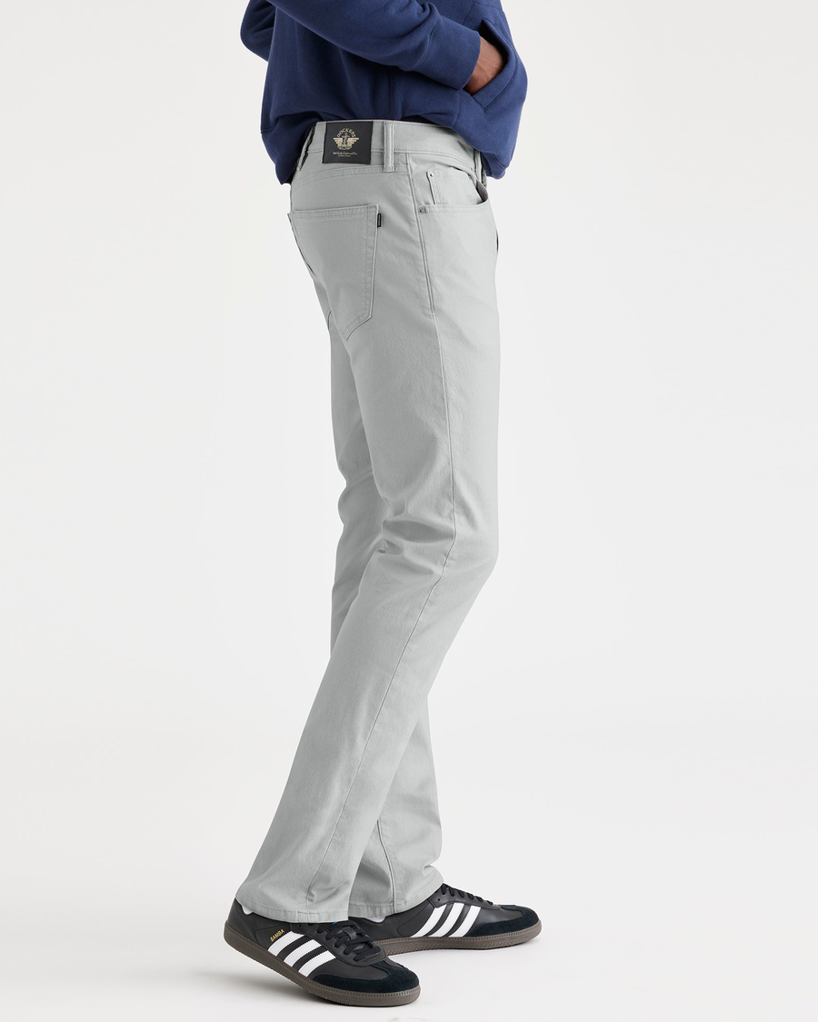 Side view of model wearing High-Rise Men's Slim Fit Smart 360 Flex Jean Cut Pants.