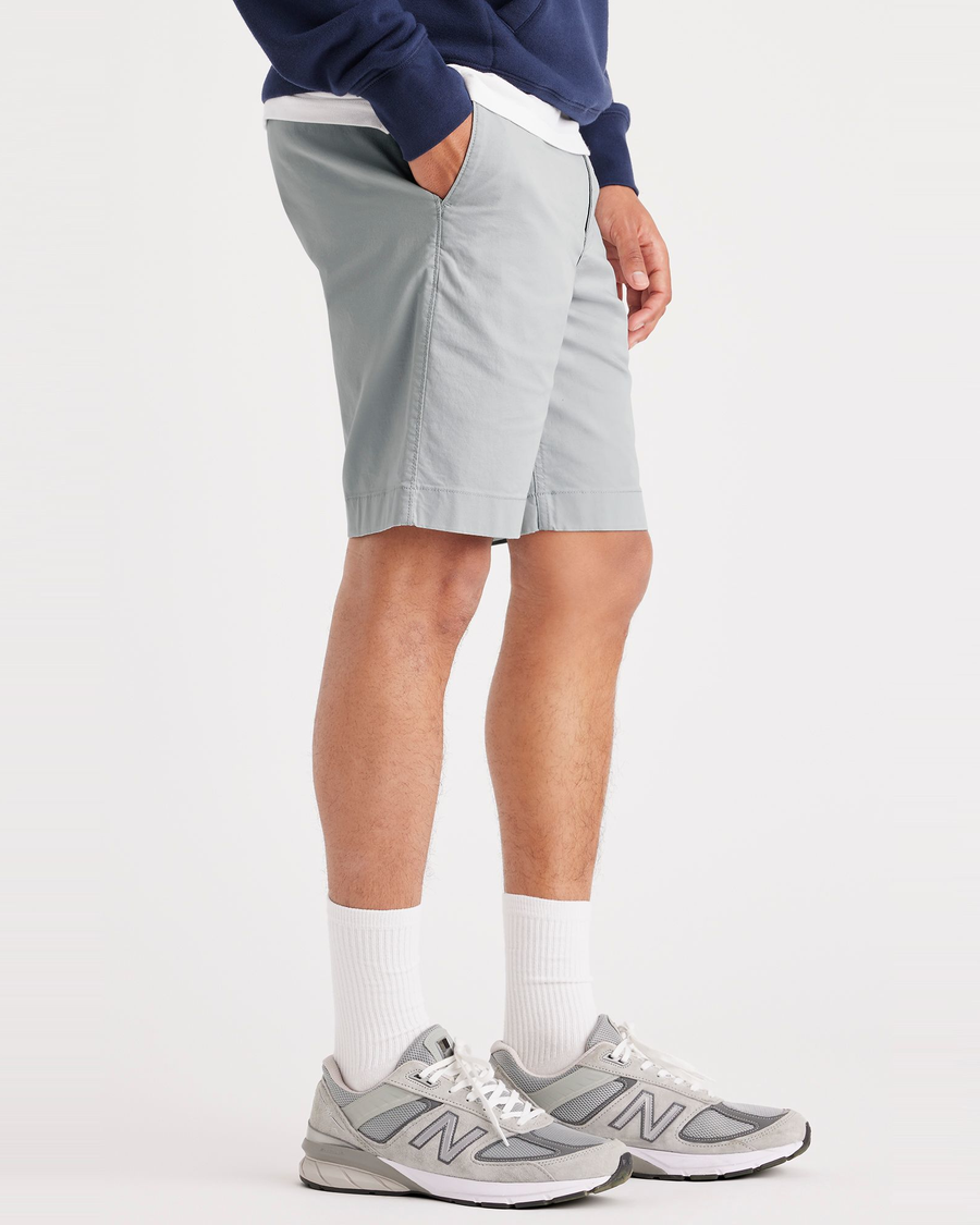Side view of model wearing High-Rise Men's Straight Fit California Shorts.