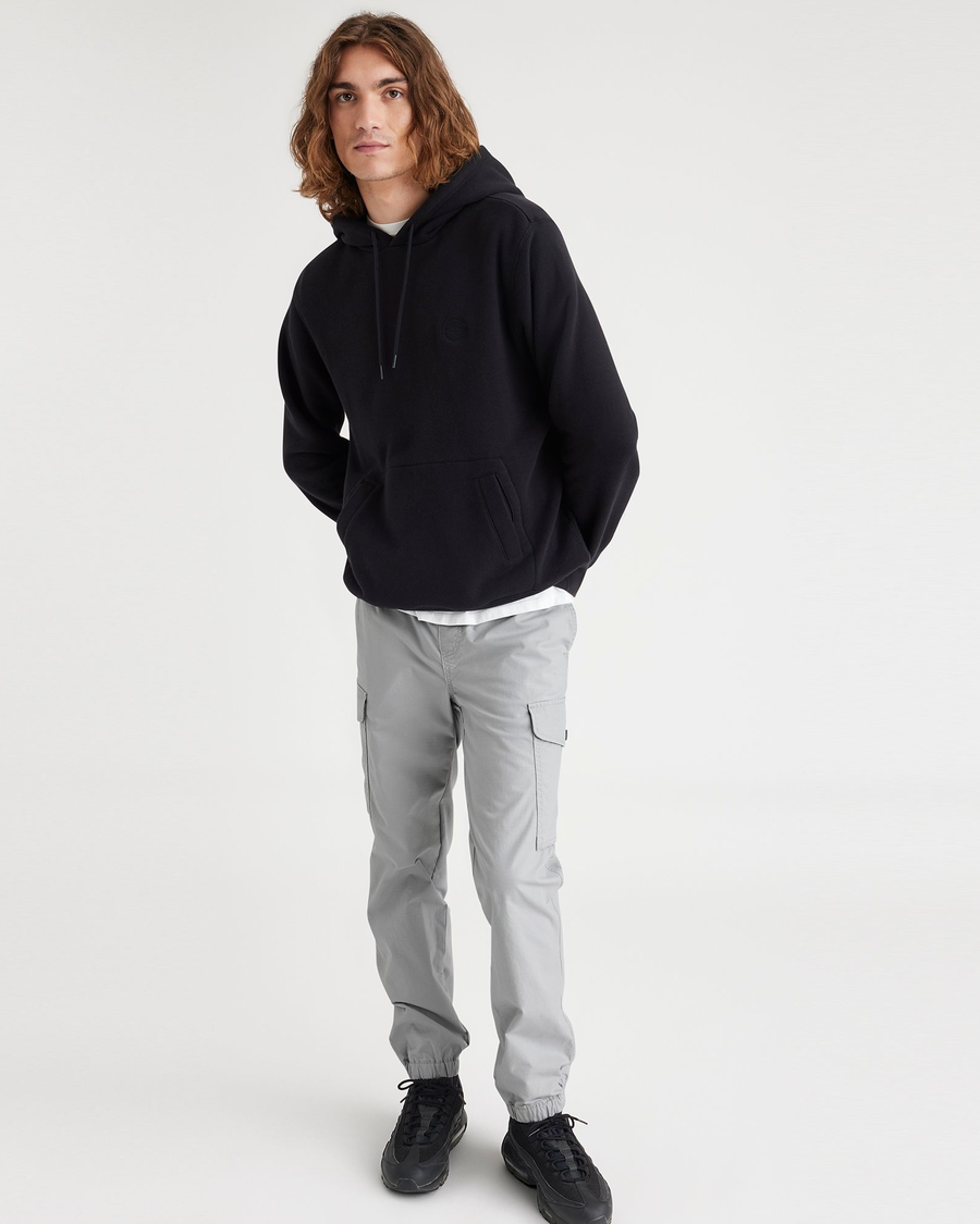 View of model wearing High-Rise Men's Straight Tapered Fit Cargo Jogger Pants.