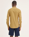 Back view of model wearing Honey Mustard Solid Men's Slim Fit 2 Button Collar Shirt.