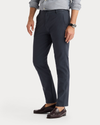 Side view of model wearing India Ink Ultimate Chinos, Slim Fit.