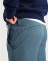 View of model wearing Indian Teal Men's Skinny Fit Smart 360 Flex California Chino Pants.