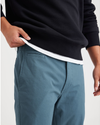 View of model wearing Indian Teal Men's Slim Fit Smart 360 Flex California Chino Pants.