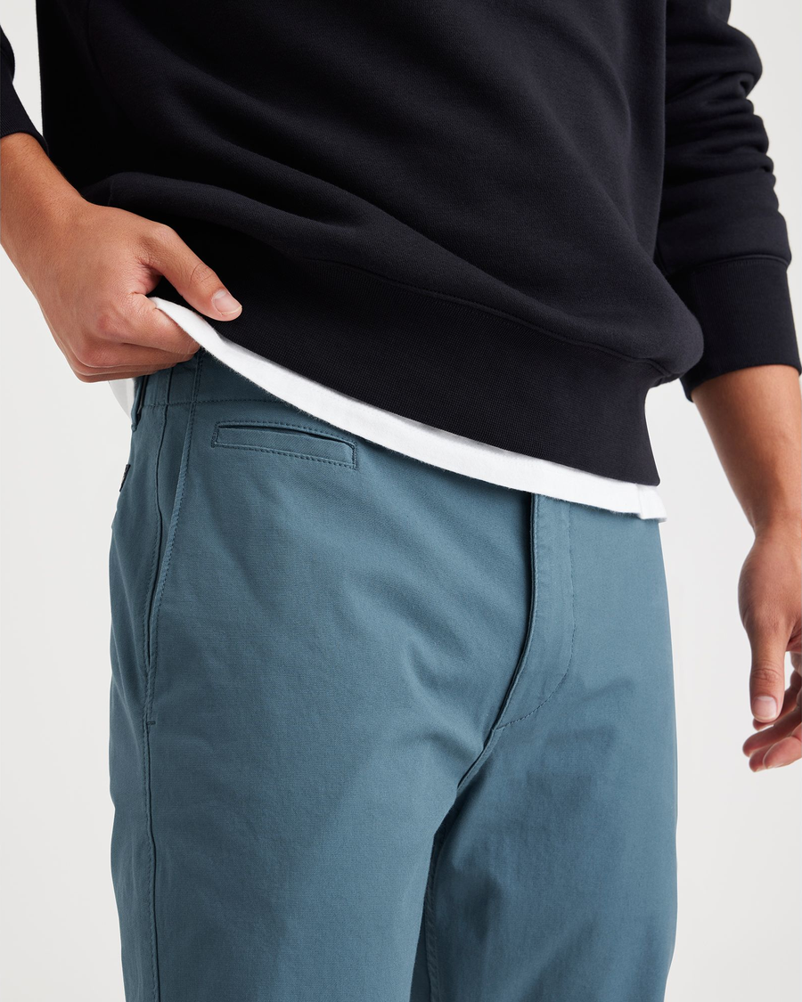 View of model wearing Indian Teal Men's Slim Fit Smart 360 Flex California Chino Pants.