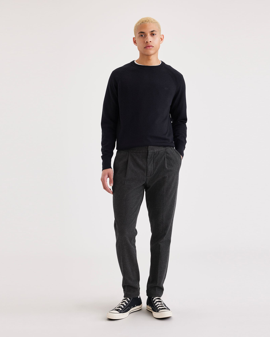 Front view of model wearing Jubilee Asphalt Men's Slim Tapered Fit Refined Pull-On Pants.