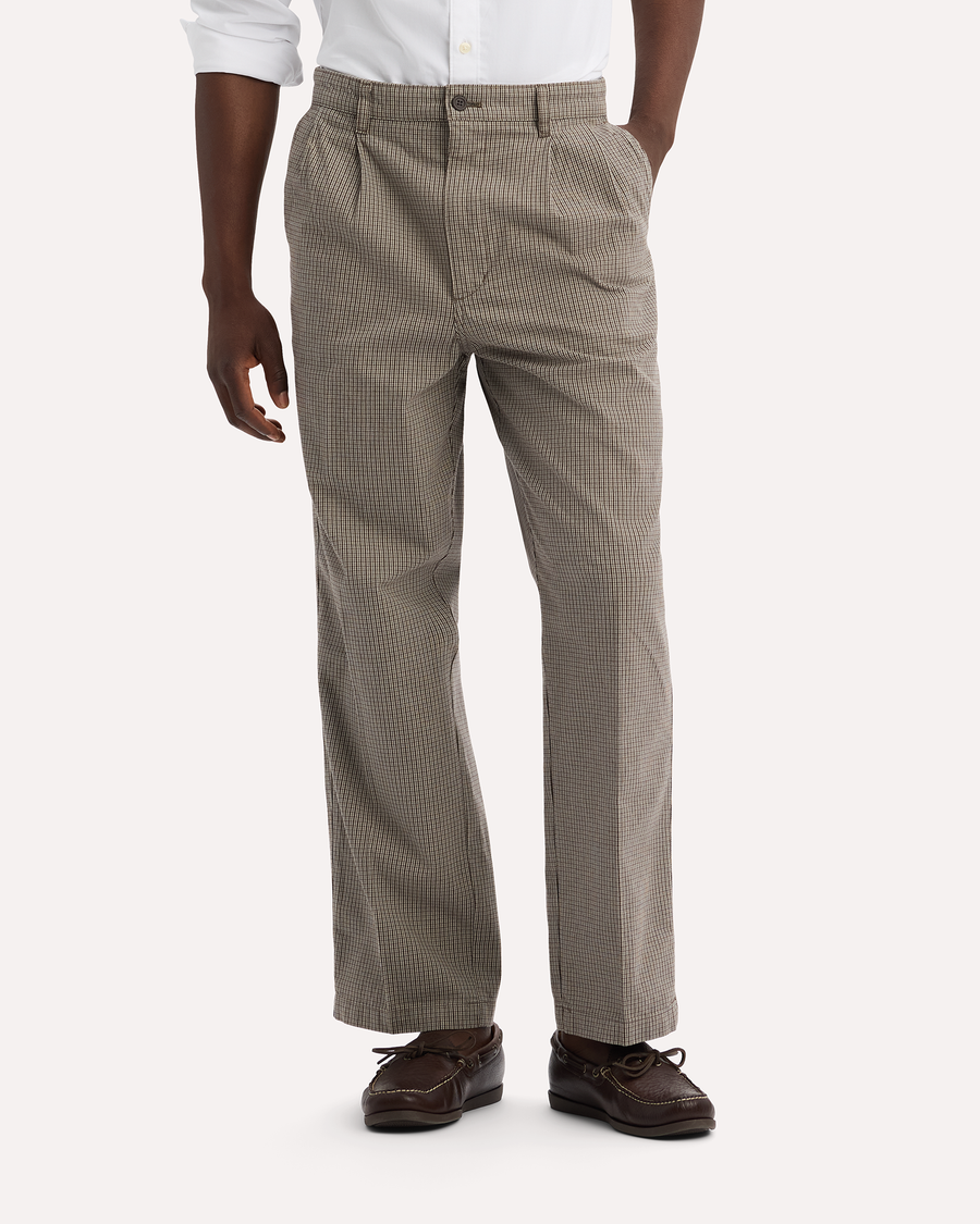 View of model wearing Lemon Pepper Eighty-Six Original Pleated Chinos, Loose Fit.